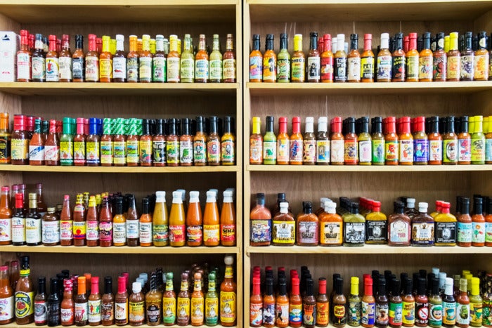 Hot sauces on shelves.